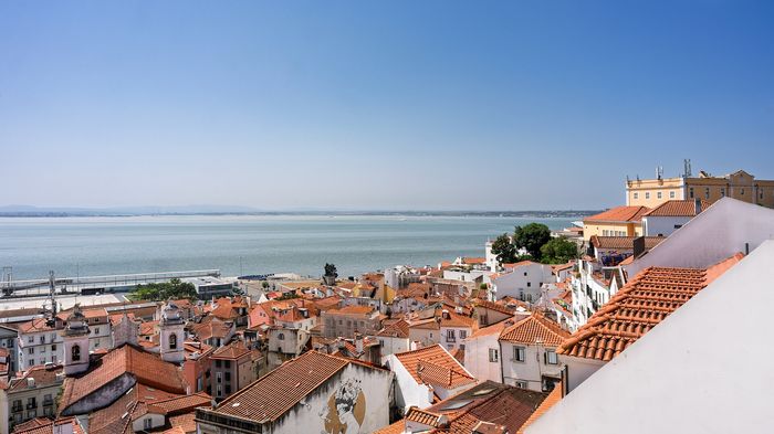 Alfama from above: lanes too narrow for cars and too long for a wheeled suitcase. The prettiest quarter in the city and the hardest to arrive in with luggage.