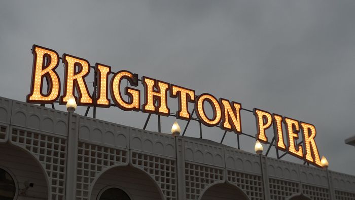 Brighton Palace Pier: the lights come on at roughly the hour the day visitors head for the station.