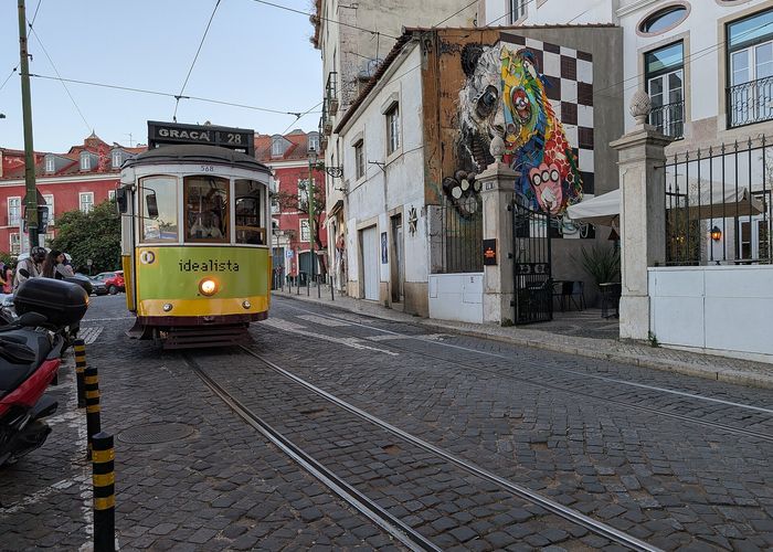 Tram 28 climbing above Alfama. Board at the far end of the line, in Campo de Ourique, not at Martim Moniz.
