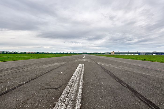 Tempelhofer Feld: the old airport runways now belong to skaters and kites, no ticket, from sunrise to sunset.